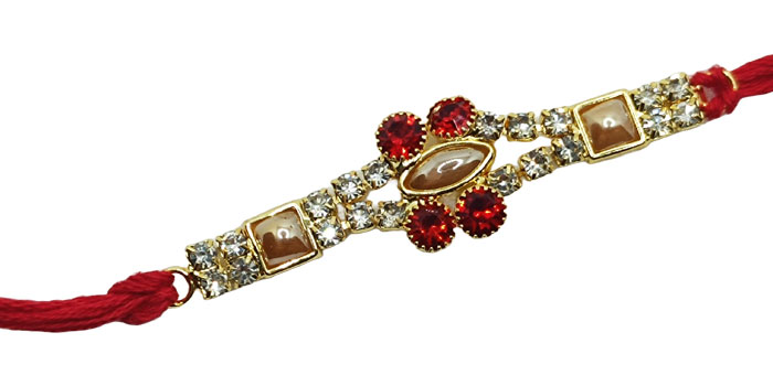 Radiant Rakhi with Vibrant Red Gemstones and Elegant Design