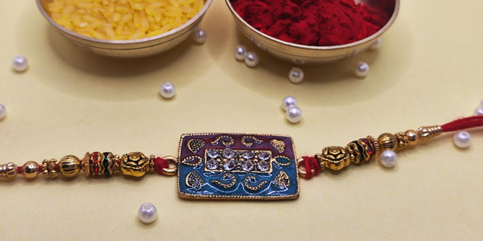 Rectangular Shaped Rakhi with Beautiful Designs and Stones and Roli - Chawal