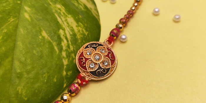 Round Shaped Rakhi with Colorful Design and Stones and Roli - Chawal
