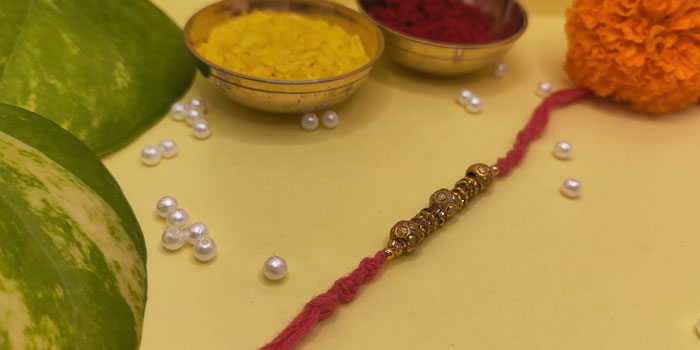 Simple Styled Rakhi with Golden Touch and Roli - Chawal