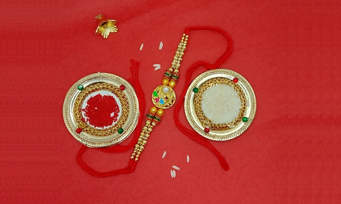 Designer White Stone Studded Rakhi with Free Roli and Chawal