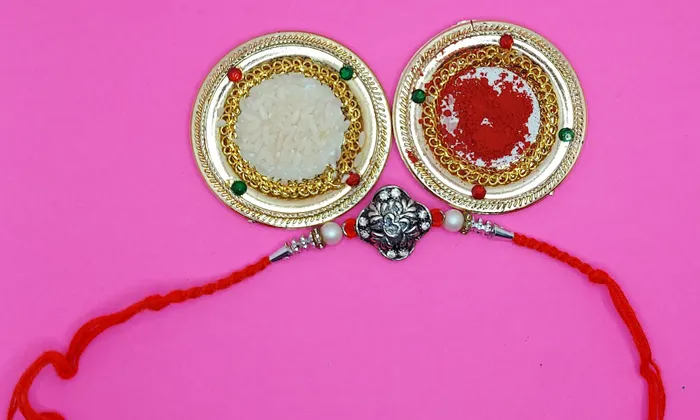 Designer Om Rakhi with Free Roli and Chawal