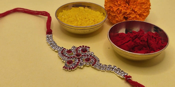 Fashionable Rakhi with Beautiful Swastik Design and Roli - Chawal